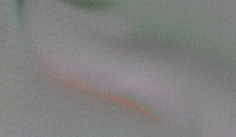 Blurred gray texture with a faint rainbow arc creates a soft indistinct bac.. Stock Illustration
