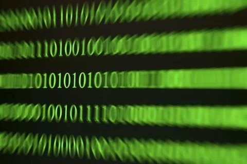 A blurred green binary code as a sign of movement and speed 写真素材