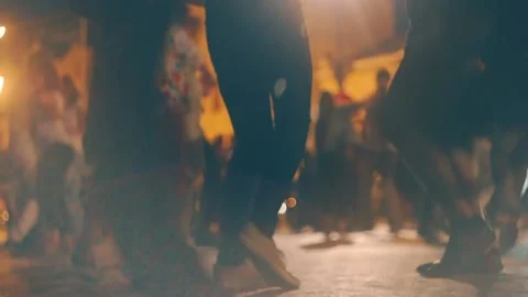 Blurred Ground level shot of young people dancing salsa on open air event. Many Stock Footage 136444556