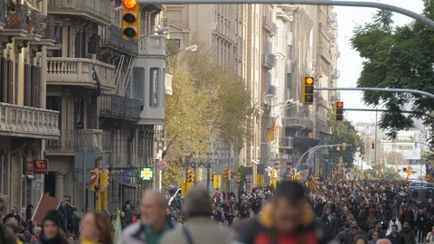 Blurred group of men walking with a crowd of people behind in Barcelona Stock Footage 106726832