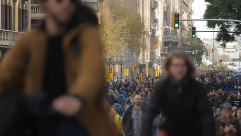 Blurred group of people walking with a crowd behind in a pro Independency dem Stock Footage 106726645