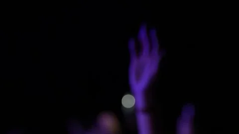 Blurred hands raised by concert crowd in complete darkness. Stock Footage 344025505