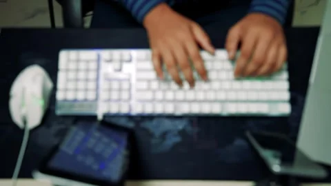 Blurred Hands Typing on Keyboard, Blurred image of hands typing on a keyboa.. Video stock 317737320
