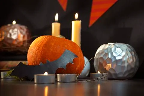 Blurred Helloween composition with pumpkins and candles Stock Photos