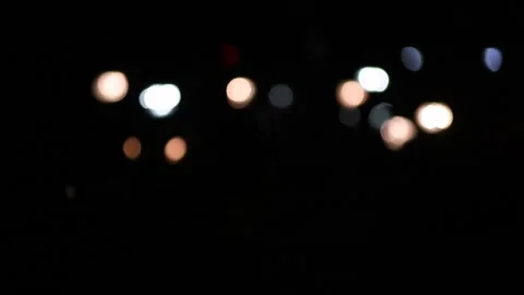Blurred highlights of vehicular traffic passing through a busy city road Stock Footage 159673270