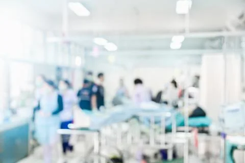 Blurred Hospital background, Unrecognized Doctors and nurses are urgently Stock Photos