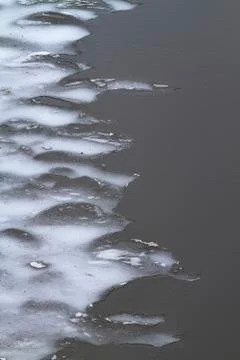 Blurred ice edge on the river Stock Photos