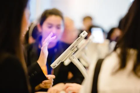 Blurred image for background of hand and tablet for registration in to semina Stock Photos