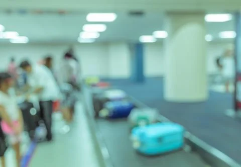 Blurred image background of passengers wait for luggage at baggage claim in a Stock Photos