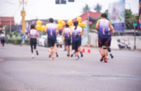 Blurred image behind the runner. Stock Photos