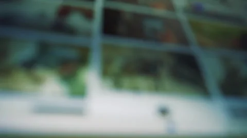 Blurred image of a computer screen displaying multiple thumbnails Stock Footage 320724087