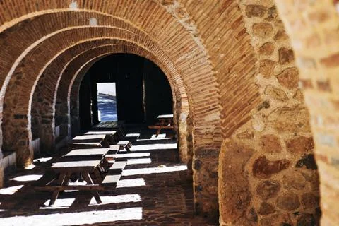 Blurred image. Corridor inside the building under construction. Brick wall, c Stock Photos