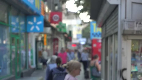 Blurred image of a crowd of people running along the windows Stock Footage 143273816