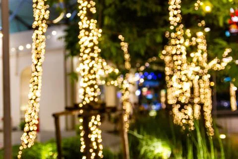 Blurred image Decorative outdoor string lights hanging in the garden 스톡 사진