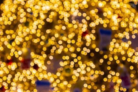 Blurred image Decorative outdoor string lights hanging in the garden at night Photos