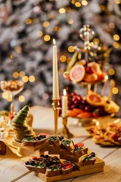 Blurred image of different types of bruschetta with cheese and fruits in a ca Stock Photos