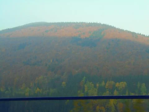 Blurred image of distant mountain forests in autumn colours,taken at high speed Stock Photos