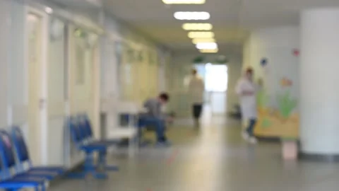 Blurred image doctors in a white coat in a polyclinic enters the office, walk Stock Footage 166663752