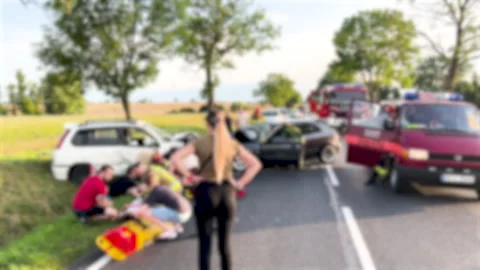 Blurred image of an emergency roadside assistance scene with paramedics 動画素材 258216887