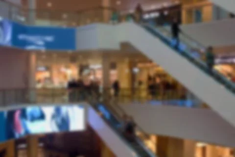 Blurred image of escalators in the Mall. Stock Photos
