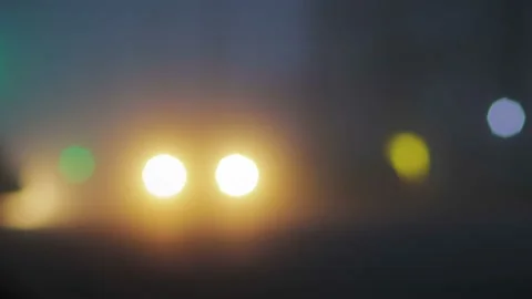 Blurred image of the evening city in thick fog, adverse weather conditions Stock Footage 98772648