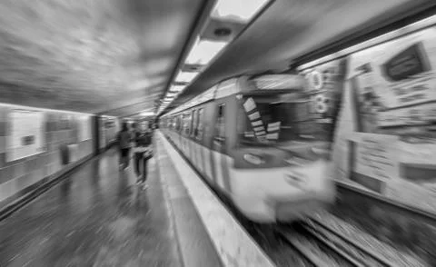 Blurred image of fast moving train in Paris metro station Photos