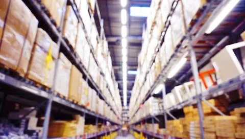 Blurred Image Inside A Modern Warehouse. Stock Photos