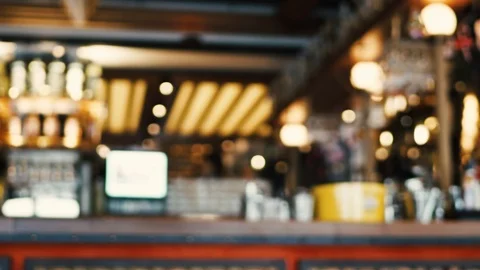 Blurred image of the interior of a large restaurant with bright lighting Stock Footage 100611836