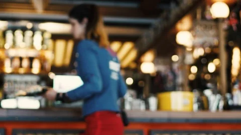 Blurred image of the interior of a large restaurant with bright lighting Stock Footage 100611850