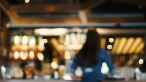 Blurred image of the interior of a large restaurant with bright lighting Stock Footage 100611868