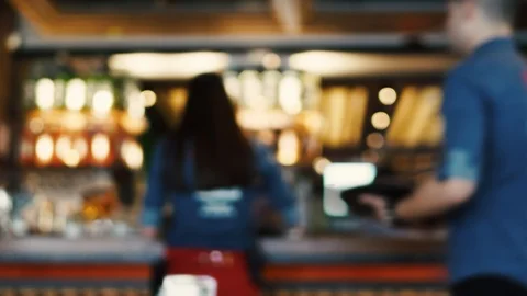 Blurred image of the interior of a large restaurant with bright lighting Stock Footage 100611895