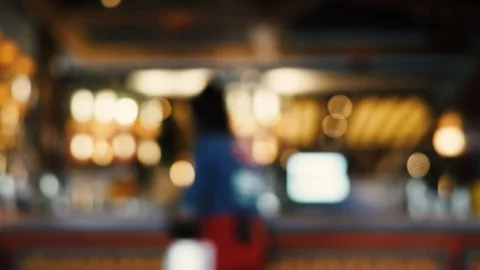 Blurred image of the interior of a large restaurant with bright lighting Stock Footage 100611967