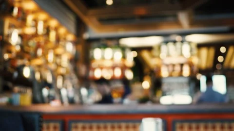 Blurred image of the interior of a large restaurant with bright lighting Stock Footage 100611990