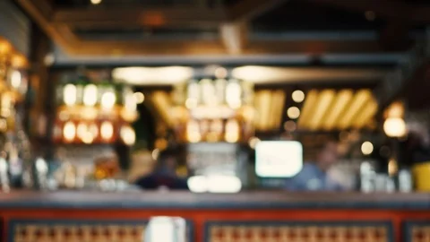 Blurred image of the interior of a large restaurant with bright lighting Stock Footage 100612143
