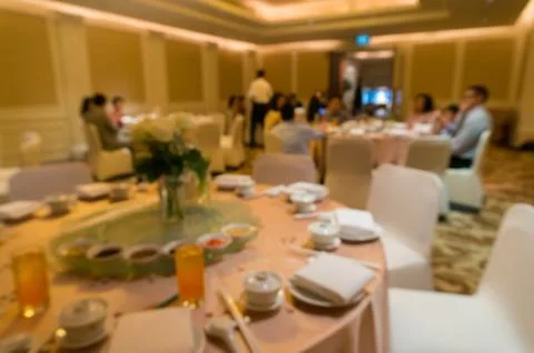 Blurred image of Large dining table set for wedding, dinner or festival event Stock Photos