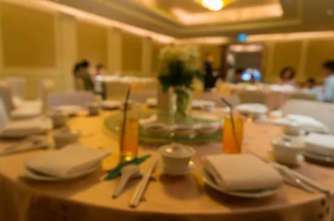 Blurred image of Large dining table set for wedding, dinner or festival event Stock Photos