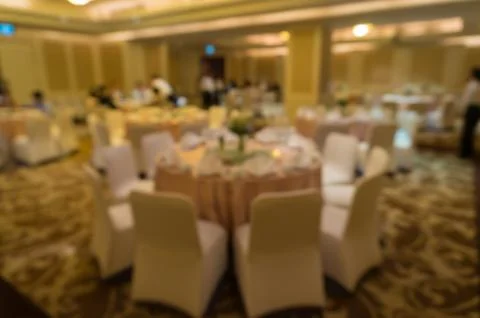 Blurred image of Large dining table set for wedding, dinner or festival event Stock Photos