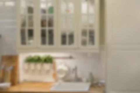 Blurred image of modern kitchen interior for background Stock Photos