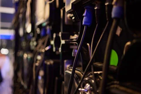 Blurred image of network cables and connections in a data center server rack  Stock Photos