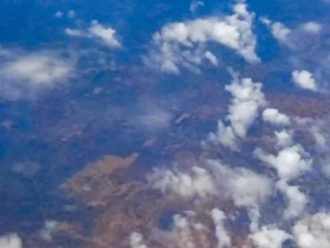 Blurred image of nice white clouds in the atmosphere, image shot in the sky f Stock Photos