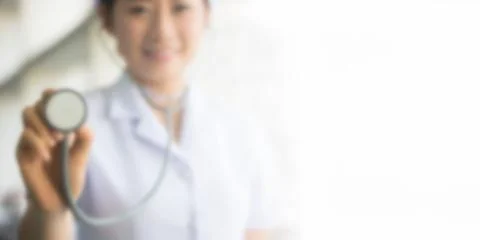 Blurred image of nurses are using stethoscope heart for background design Stock Photos
