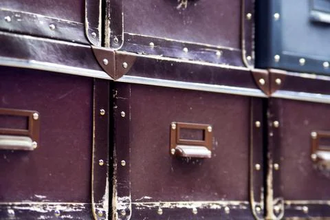 Blurred image of Old boxes are stacked on a shelf. Soft focus. Stock Photos