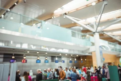 Blurred image of passengers waiting in queue at a check-in counter Stock Photos