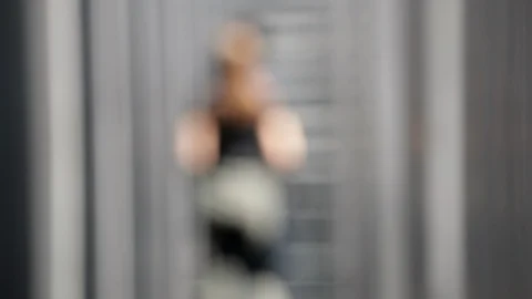 Blurred image with people walking in corridor slow motion graphics element Stock Footage 130123687