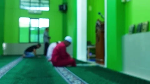 Blurred image of a person praying inside  스톡 동영상 325180970
