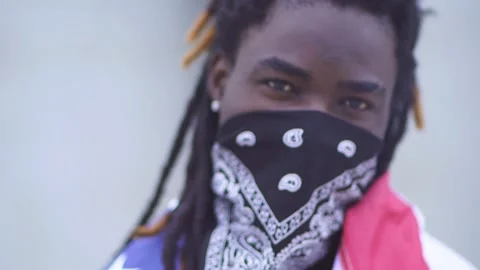 Blurred image of protesting activist in mask in street. Rebellion, having fun Stock Footage 131930611