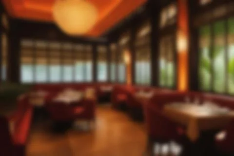 Blurred image of restaurant with light and bokeh for background usage. Blur.. Stock Photos