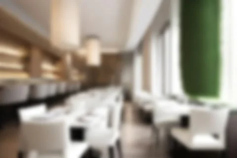 Blurred image of restaurant with light and bokeh for background usage. Blur.. Stock Photos