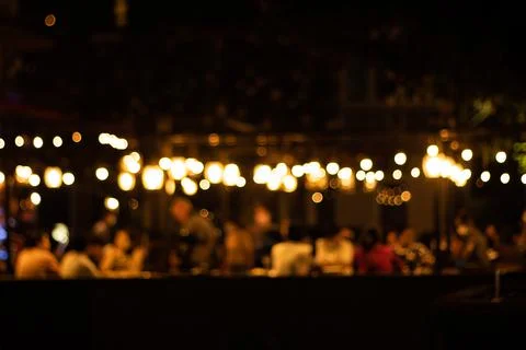 Blurred image at the restaurant night time, many people in the restaurant 스톡 사진