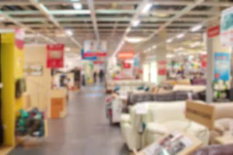 Blurred image of a section of sofas in a huge furniture store Stock Photos